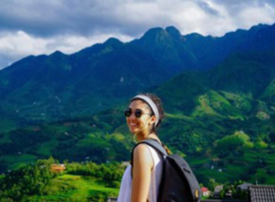 Brittany Hannouch in Vietnam with mountains in background