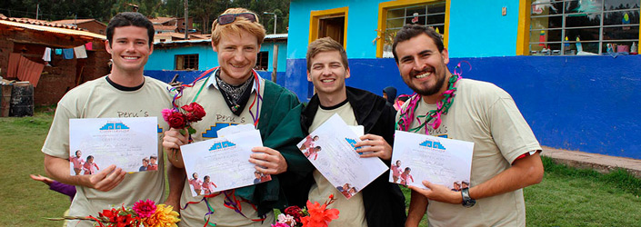 Four PACE Alumni posing for a picture holding their PACE activity certificates in Peru.