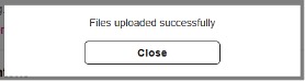Screenshot of a dialogue box that reads 'Files uploaded successfully' above a white close button.