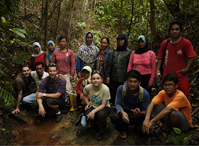 Students and Malaysian group in rainforest