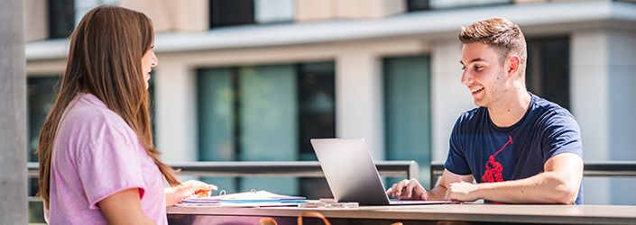 two students studying facing each other