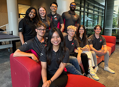 The Residential Life team, nine smiling people in polo shirts.