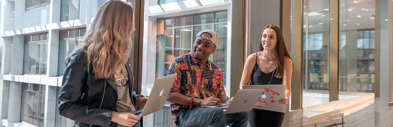Students with laptops on their lap