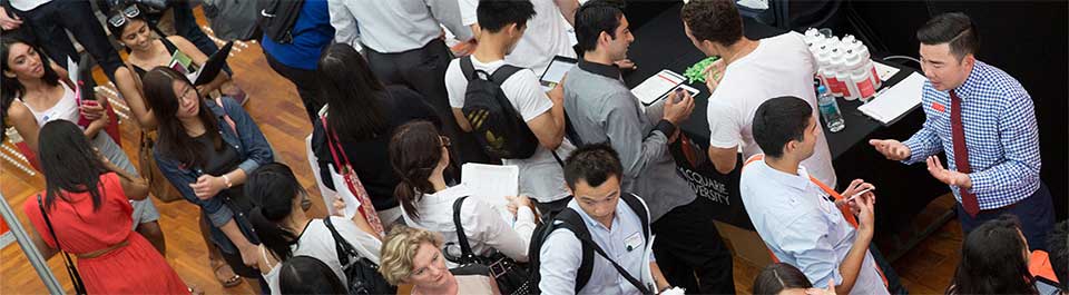 A large group of people at a careers fair