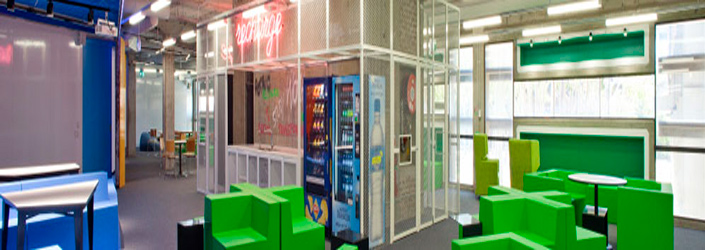 Recharge station with seats and vending machines available for student use.